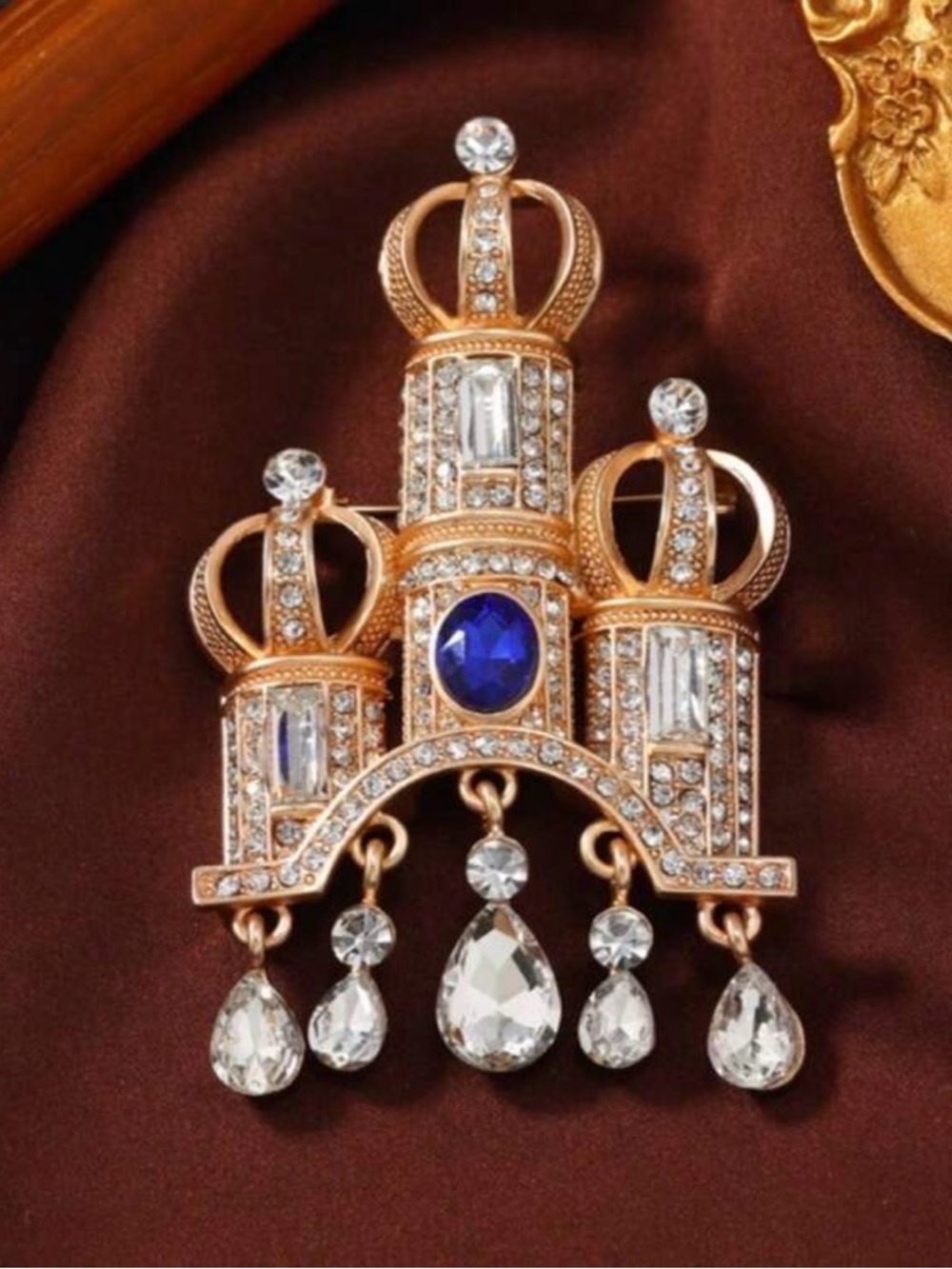 Gold-Tone Crown Drop Brooch with Blue Center Stone